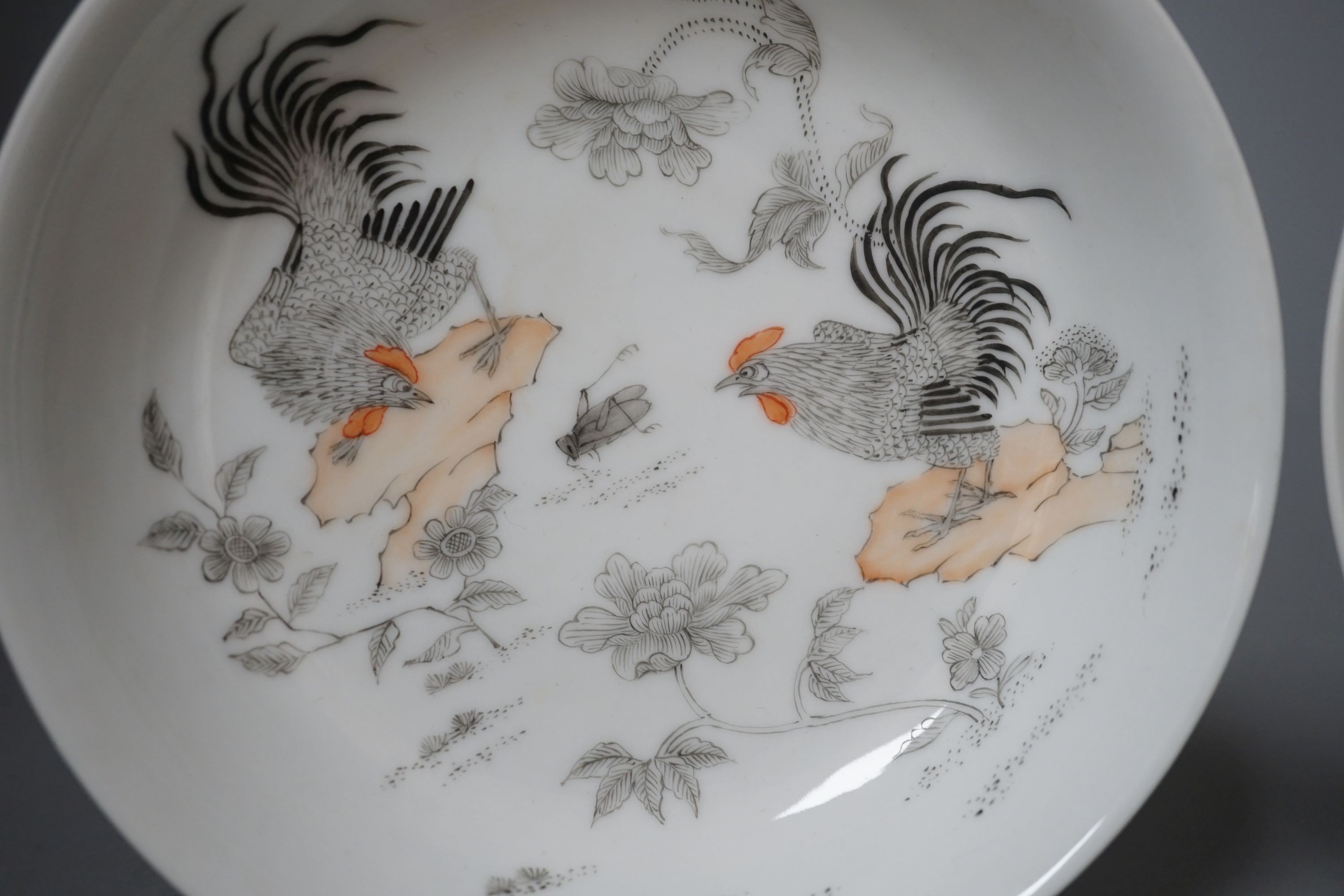 A pair of Chinese rouge de fer saucer dishes, 14 cm diameter